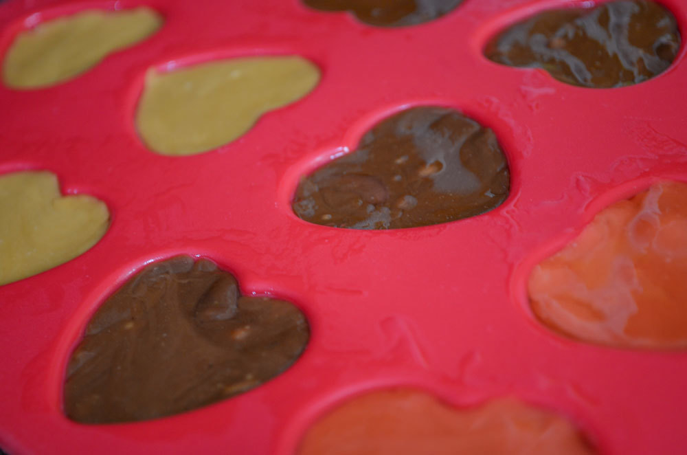 Recipe: Chocolate & Strawberry Valentine's Day Candy Hearts Made With Strawberry Cow Tales®, Silicon Heart Candy Mold, Valentine's Day Sprinkles, and Chocolate Chips