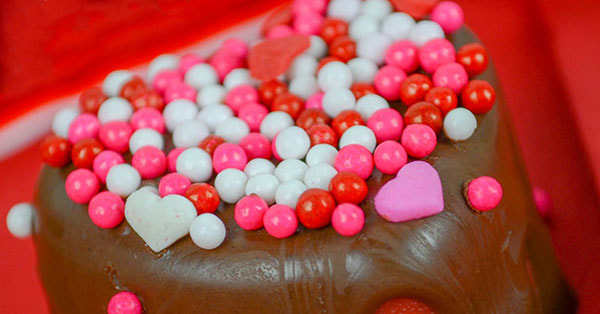 Recipe: Strawberry Cow Tales® Candy Hearts Dipped in Chocolate.